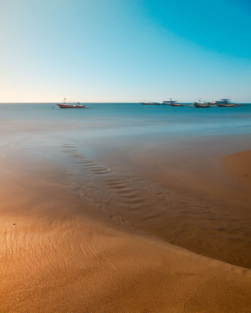 Fishing boats on the beach. Beautiful seascape at sunset.の写真素材