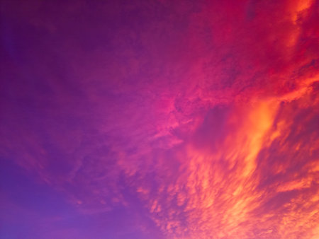 Colorful sunset sky with clouds in purple and pink colors. Abstract background.の写真素材