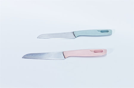 Minimalist Kitchen Knife with Light Blue Handle on White Background