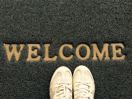 shoes on welcome alphabet on the floorの素材