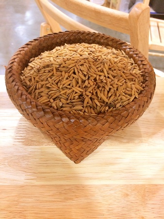 raw rice in wood basket, Thailand riceの素材