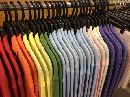 row of working shirt hanging orderly on cloth shopの素材