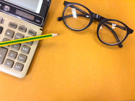 top view and copy space of office equipment and assessory on desk table with notebook, pencil on...