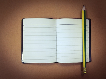 top view and copy space of office equipment and assessory on desk table with notebook, pencil on...