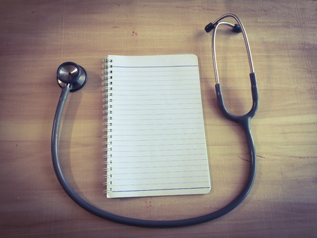 close up stethoscopes for doctor working or education with copy spaceon desk tableの写真素材