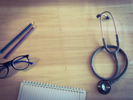 close up stethoscopes for doctor working or education with copy spaceon desk tableの写真素材