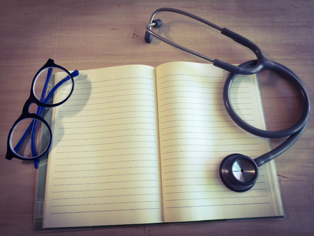 close up stethoscopes for doctor working or education with copy spaceon desk tableの写真素材