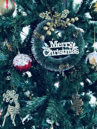 Christmas is coming every house and shop decorates the Christmas tree with a gift box and other decorations beautifully for the festival of happinessの写真素材