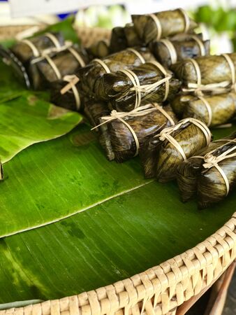 Traditional Thai dessert wrapped in banana leaves