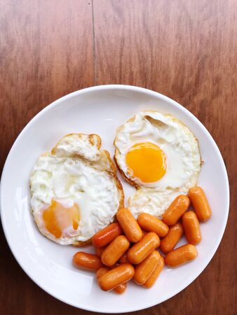 close up fried egg and sausage,breakfast set ,foods travel and cuisine conceptの写真素材
