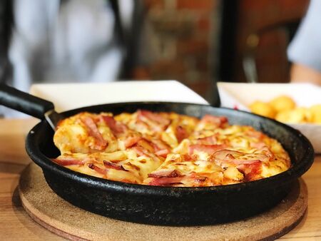 close up pizza pan paste on tray backgroung,Italy food delivery conceptの写真素材
