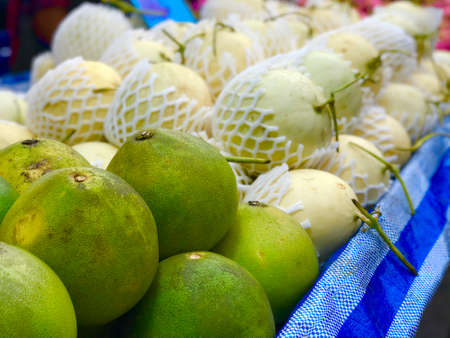 fresh Pomelo fruits sale in the market, food and fruits concept