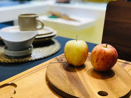 close up potrage photo of apples and orange, put on the tray decorationの写真素材
