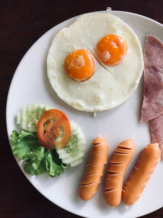 top view of fried egg and sausage,breakfast set ,foods travel and cuisine conceptの写真素材
