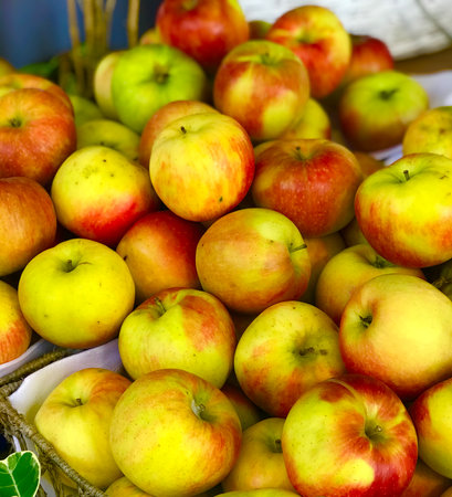 close up photo of apples, put up for sale on shelf in the fruit market or supermarket