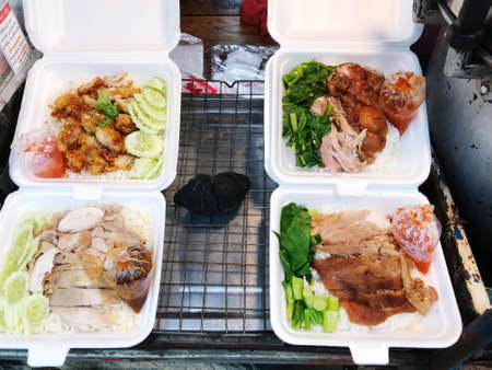 close up arrange for serve of Stewed pork leg on rice with accessoriesの写真素材