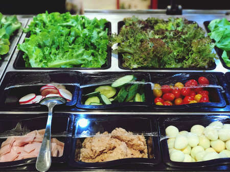 fresh vegetable salad are beautifully placed in a tray for customers to choose, Healthy Food concept