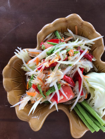 top view of Somtum papaya Salad with fresh crab is famous spicy salad Thai food, food travel and cusineの写真素材