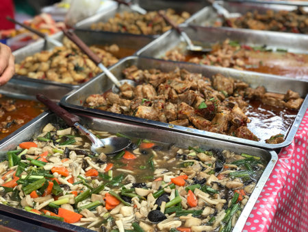 Cooking food sale in the market and ready to eat in a stainless steel tray. There are many menus to choose from.の写真素材
