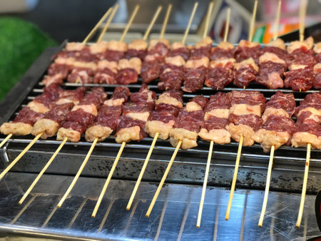 Grilled meat skewers on the grill. Street food concept.