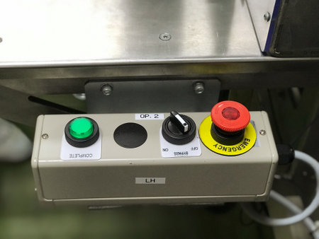 Close-up of control buttons on control panel of industrial machine.の写真素材