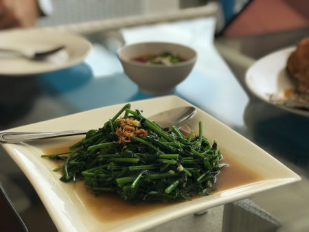 Thai food, stir-fried sweet and sour water spinach with garlicの写真素材