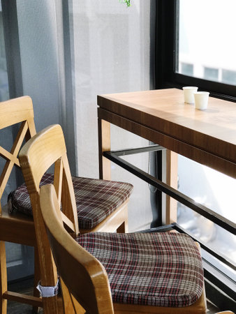 Wooden chairs and table in a cafe, interior design concept.
