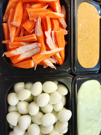 Pickled vegetables in plastic box, closeup of food background.