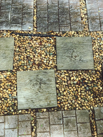 Paving stones and wooden walkway, close up. Abstract background
