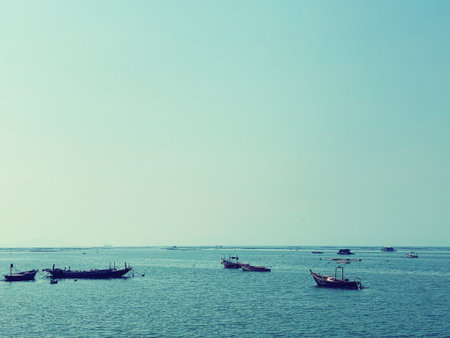 Fishing boats in the sea with blue sky background, Thailand.の写真素材