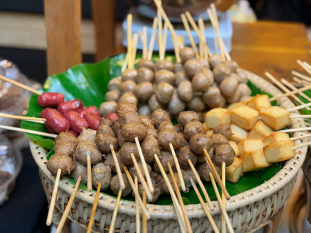 Meatballs on skewers at street food market in Thailand, Asiaの写真素材