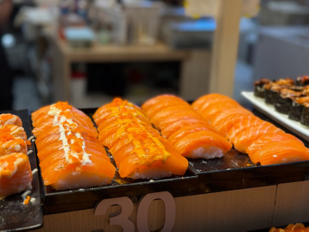 Sushi on the counter of a Japanese restaurant. Selective focus.の写真素材