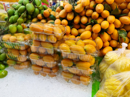 Marian plum or Marian plum fruit on the counter in the marketの写真素材