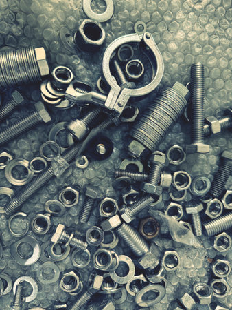 Nuts and bolts on metal background with filter effect retro vintage styleの写真素材