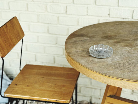 Wooden table and chairs in a cafeの写真素材