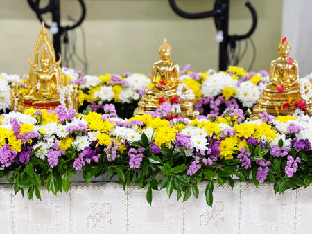 Buddha statue and flowers in the temple for worship, Thailand.の写真素材