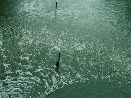 Fishing rod on the surface of the water. Shallow depth of field.の写真素材