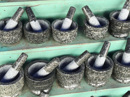 Mortar and pestle in a row, closeup of photo