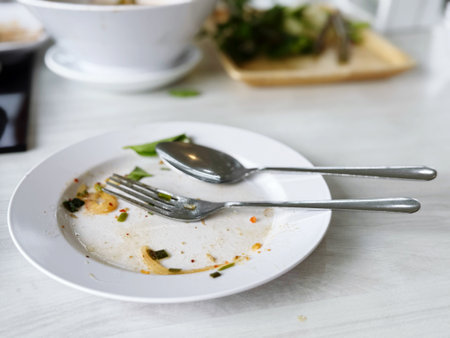 After eating, the food plates are placed on the table.の写真素材