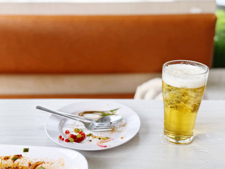 Glass of beer on a table in a restaurant. Close-upの写真素材
