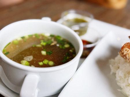 A bowl of white soup to go with food.の写真素材