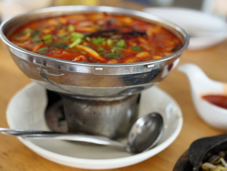 Tom yum kung, Thai spicy soup in a metal bowlの写真素材