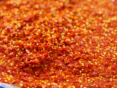 Close up of spicy chilli sauce on display at a street food market