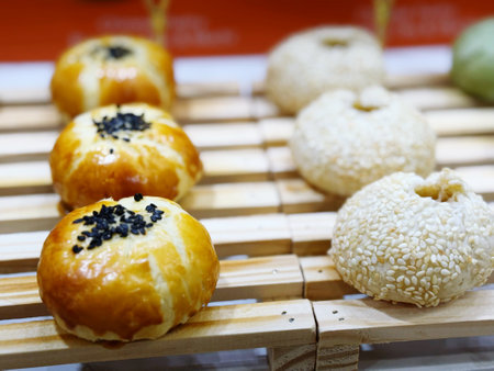 Chinese pastry with black sesame, chinese bun on bamboo trayの写真素材