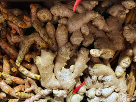 Close up of fresh ginger root on display at a market stall.の写真素材
