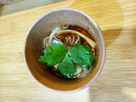 Japanese miso soup in a bowl on a wooden table top view