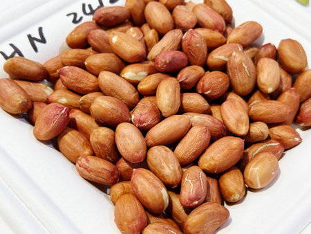 Peanuts in a box on a market stall. Close-up.
