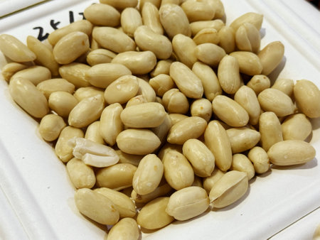 Peanuts in a white box, closeup of photo
