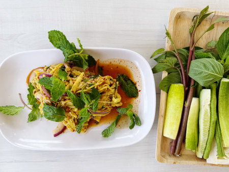 Spaghetti with basil and egg on white plate, Thai food.