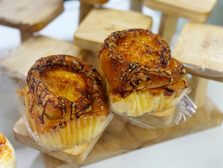 Egg tart or egg tart on wooden table, thai foodの写真素材